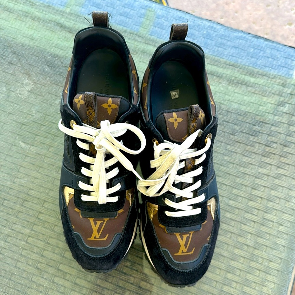 Lv tennis shoes like new. I wore them 10 times max. Sold with dust bag.
